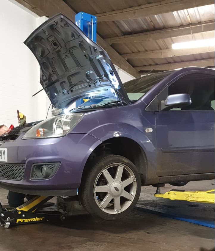 Mechanic working on a car